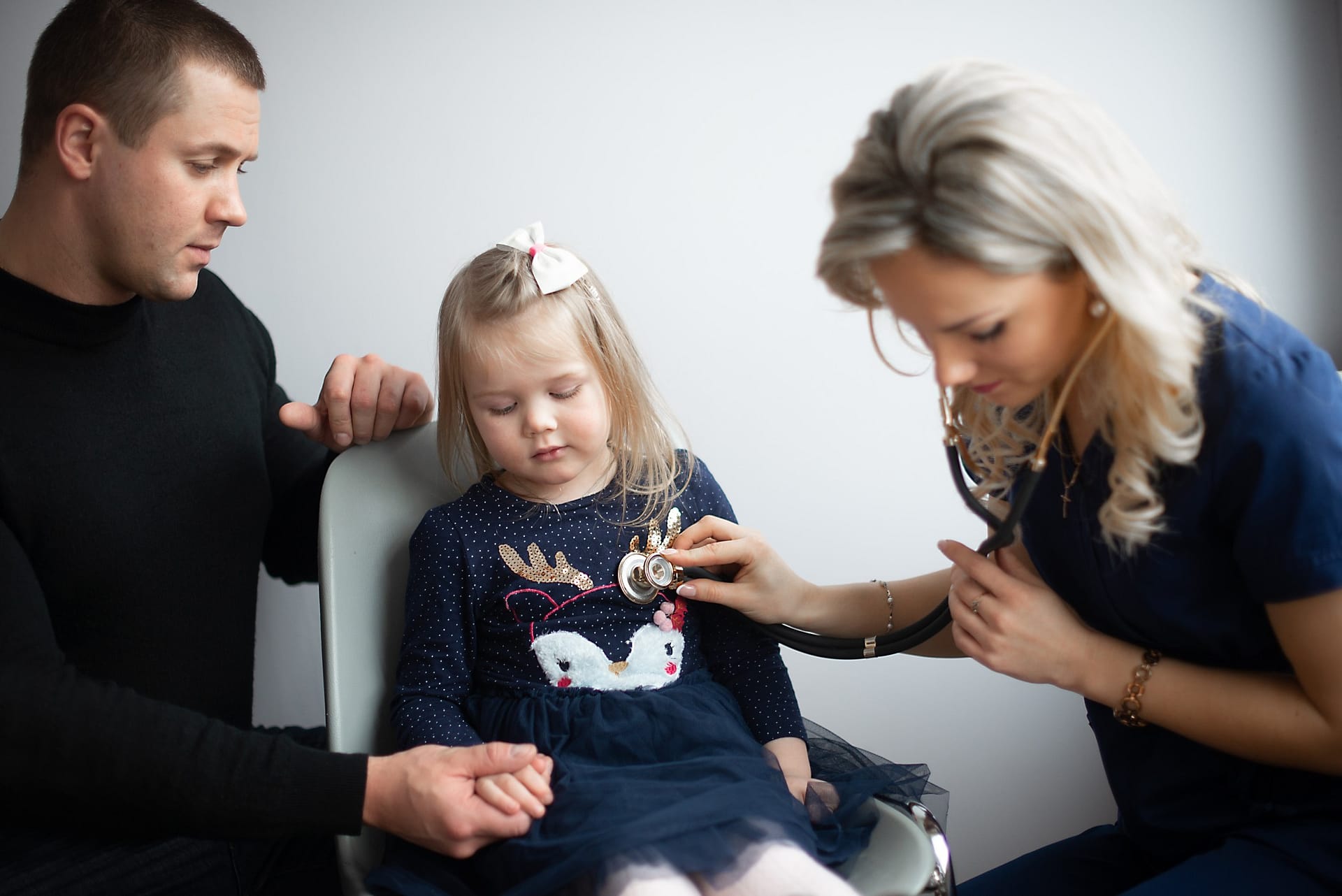 kind-and-friendly-doctor-pediatrician-with-stethoscope-listening-little-girl-heart-beat-and_t20_NxAdPB